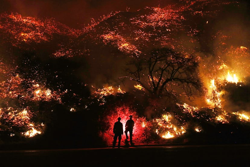 Firefighters standing in front of California wildfires