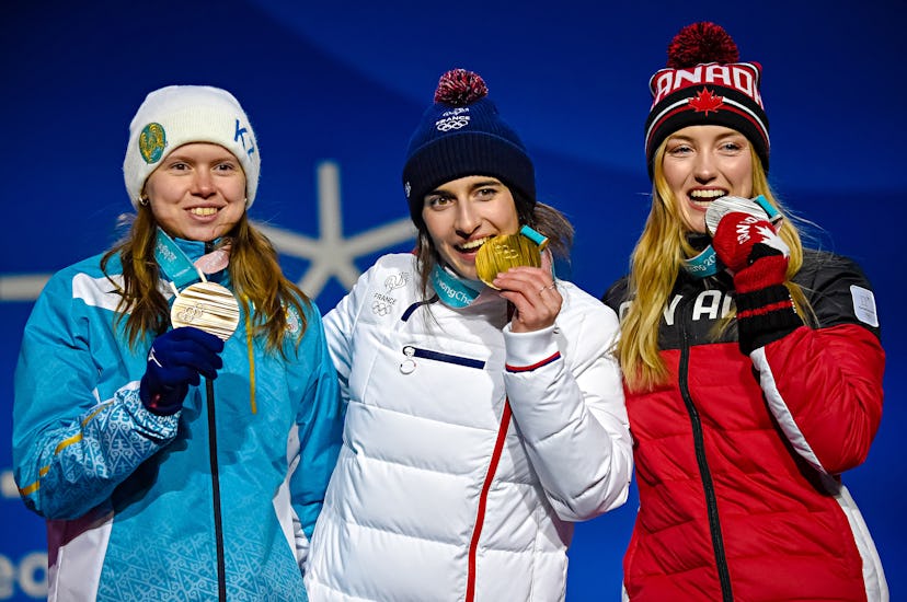 Three sportswomen with their gold, silver, and bronze medals