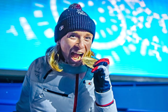 A winter sport athlete posing with an Olympic bronze