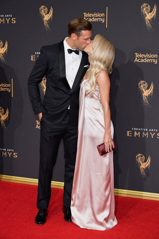 Julianne Hough and Brooks Laich kissing on a red carpet 