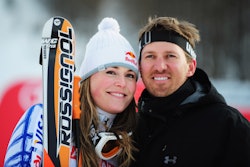 Lindsey Vonn posing for a photo with her husband Thomas after a race