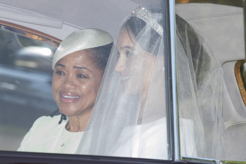 Meghan Markle in her wedding dress driving in the car