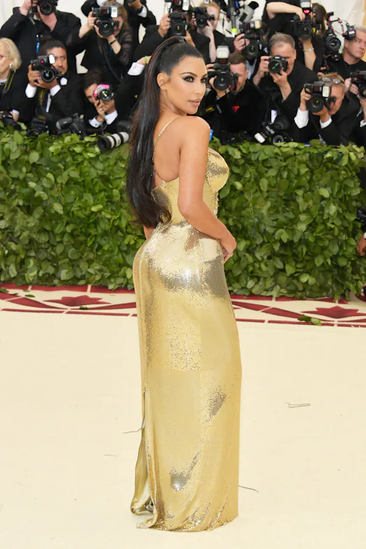 Kim Kardashian's 2018 Met Gala Dress Was Liquid Gold Versace & Channeled Cleopatra Kim Kardashian's 2018 Met Gala Dress Was Liquid Gold Versace & Channeled Cleopatra