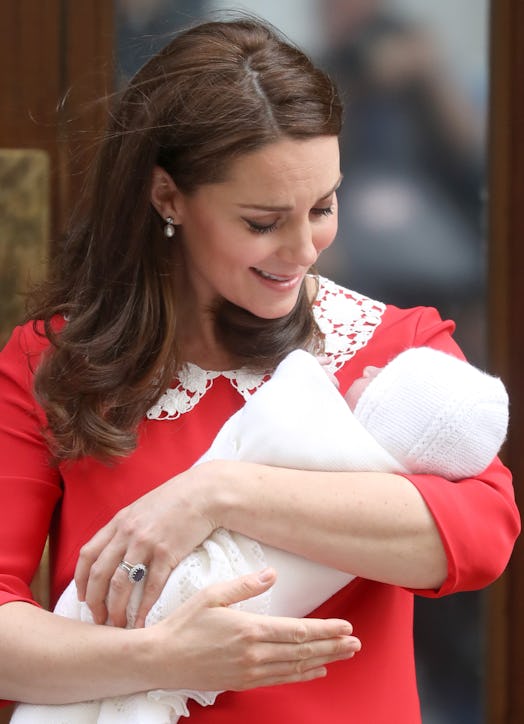 Kate Middleton holding a baby