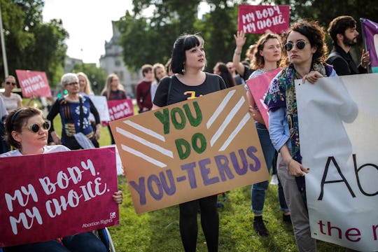 Group of abortion rights demonstrators holding banners