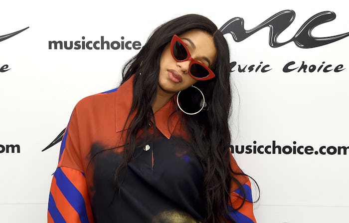 Cardi B in a orange-blue-black top and black sunglasses at the Music Choice Awards
