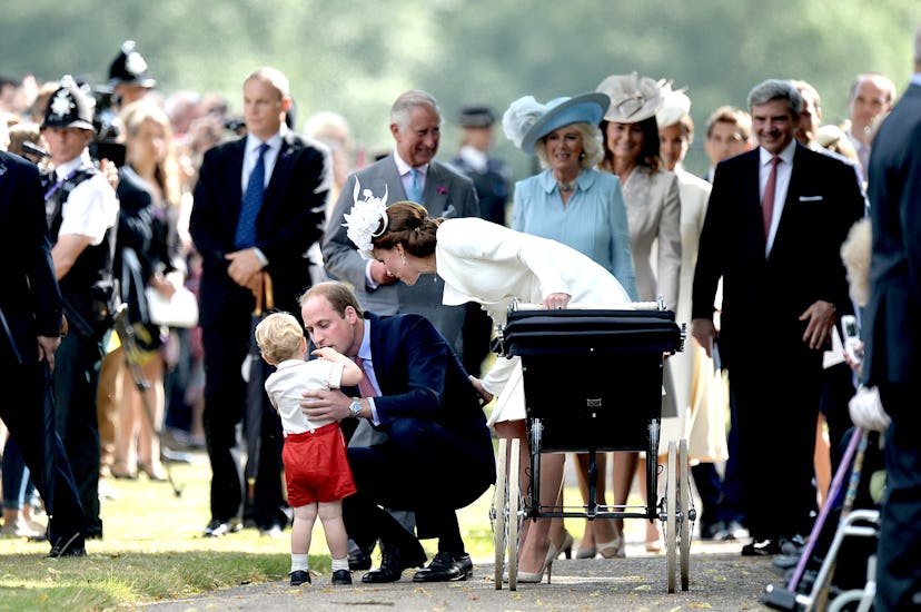 Kate and William talking to the prince Louis and King Charles walking behind them