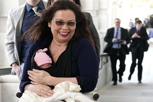 Tammy Duckworth holding her newborn baby