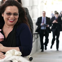 Tammy Duckworth holding her newborn baby