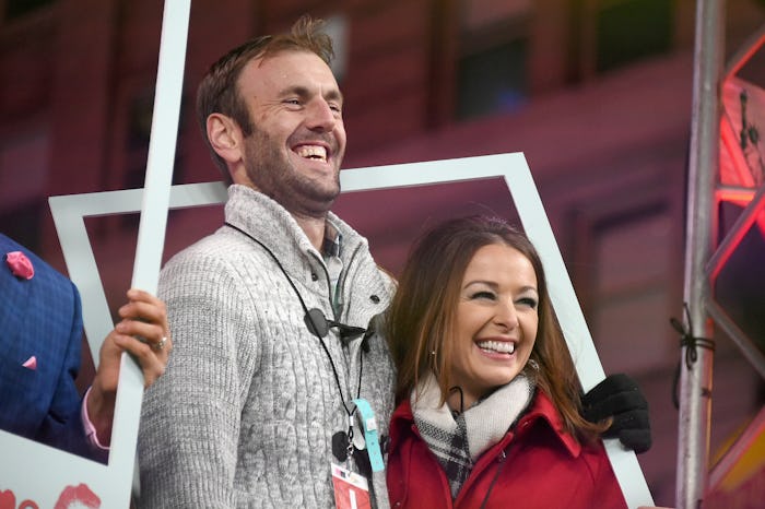 Jamie Otis and his wife hugging and smiling