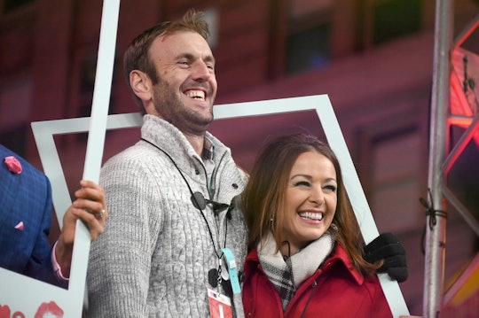 Jamie Otis and his wife hugging and smiling 