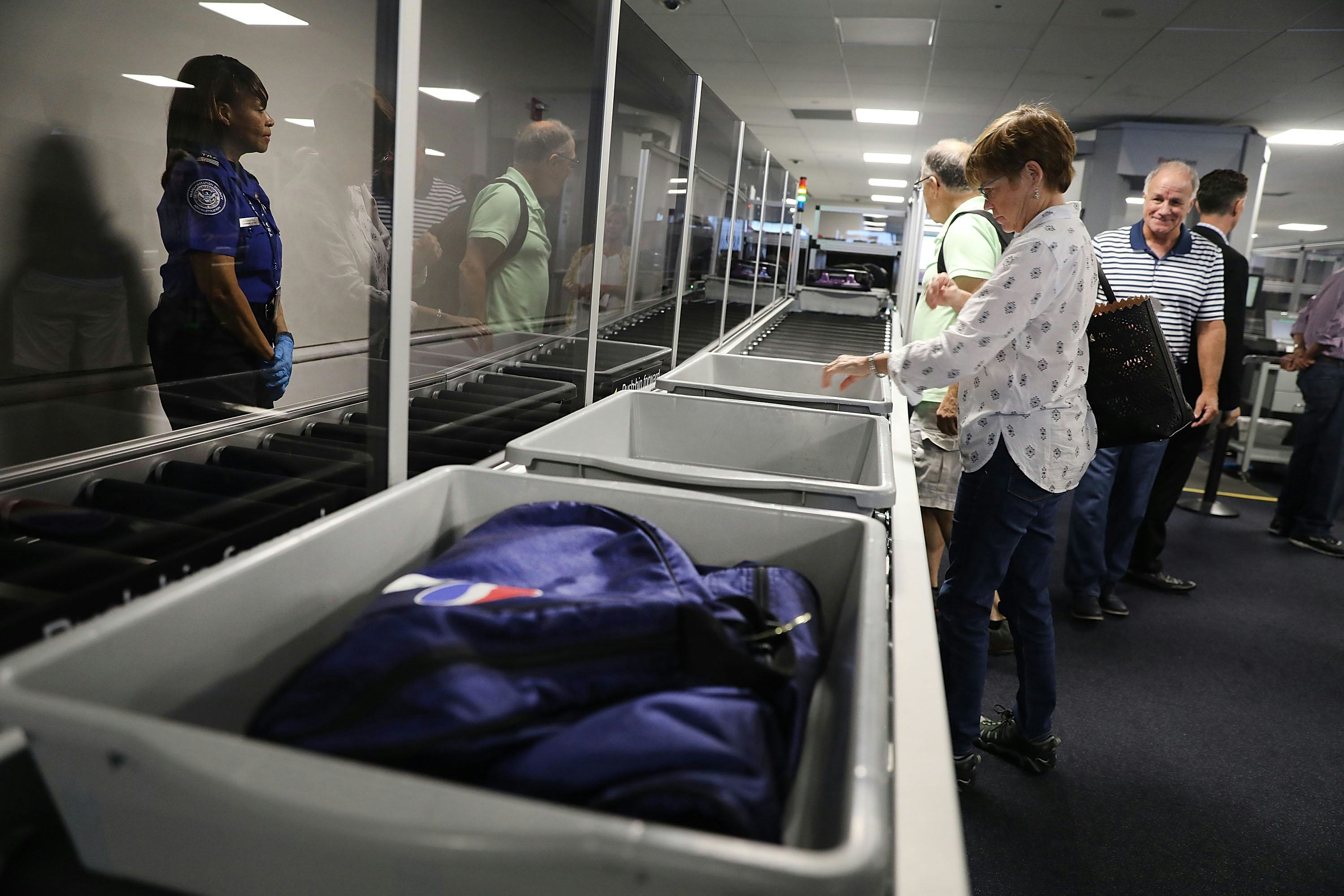 The Germiest Place In The Airport May Be The Bins You Go Through
