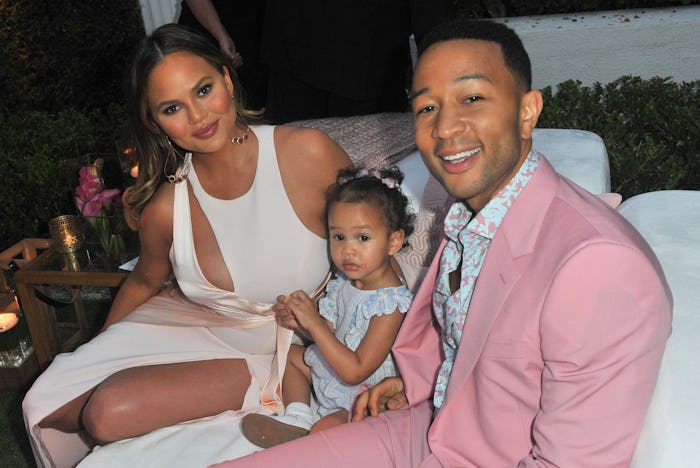 Chrissy Teigen poses with her daughter Luna and husband John Legend.