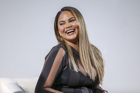 Chrissy Teigen speaks at an event.