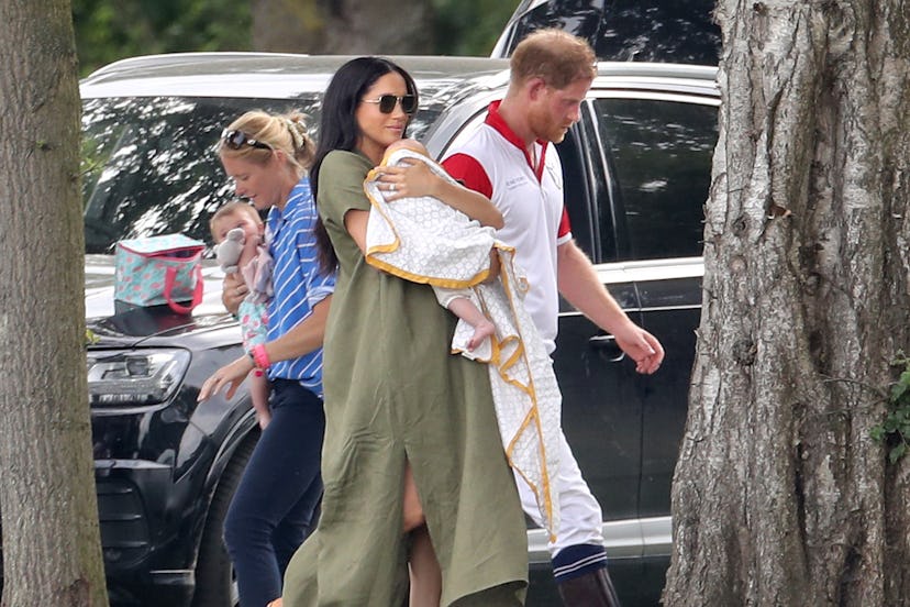 Meghan Markle & Prince Harry with baby Archie at a polo match in July