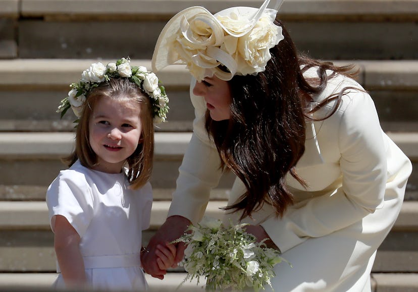 Kate Middleton talks to Princess Charlotte at Prince Harry and Meghan Markle's wedding. 
