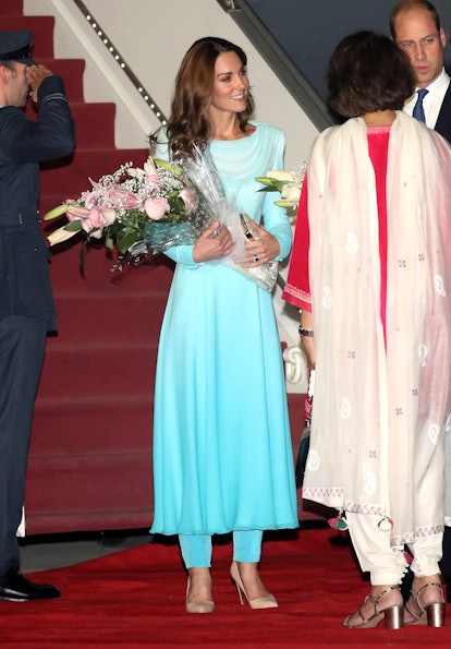 Kate, Duchess of Cambridge arrived in Pakistan wearing a Catherine Walker outfit similar to one Prin...