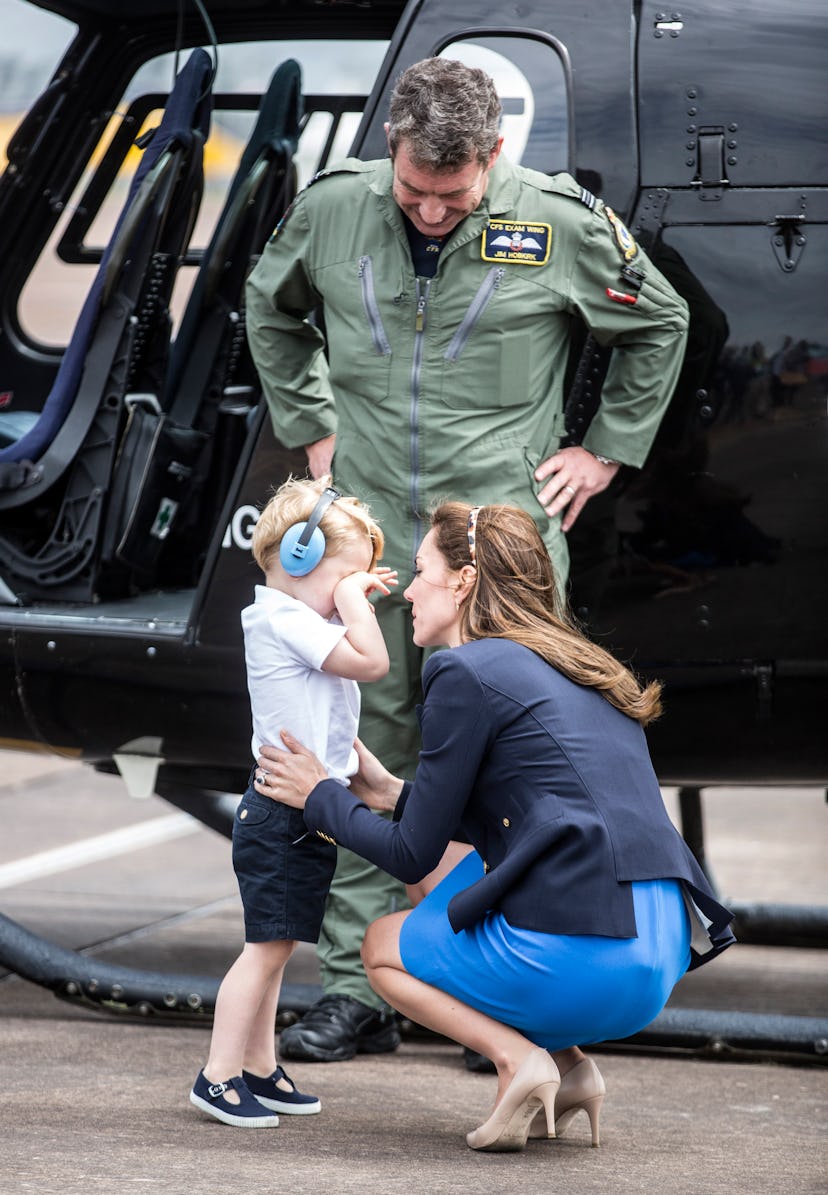 Kate Middleton comforts Prince George at the world's largest air show.