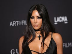 Kim Kardashian stuns in a black slip dress at the LACMA film gala.