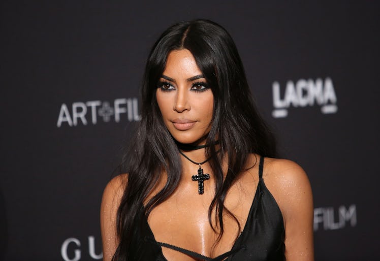 Kim Kardashian stuns in a black slip dress at the LACMA film gala.