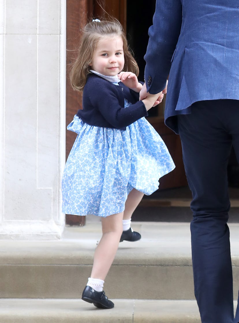 Princess Charlotte waved to the crowds as she made her way into the Lindo Wing to meet her new baby ...