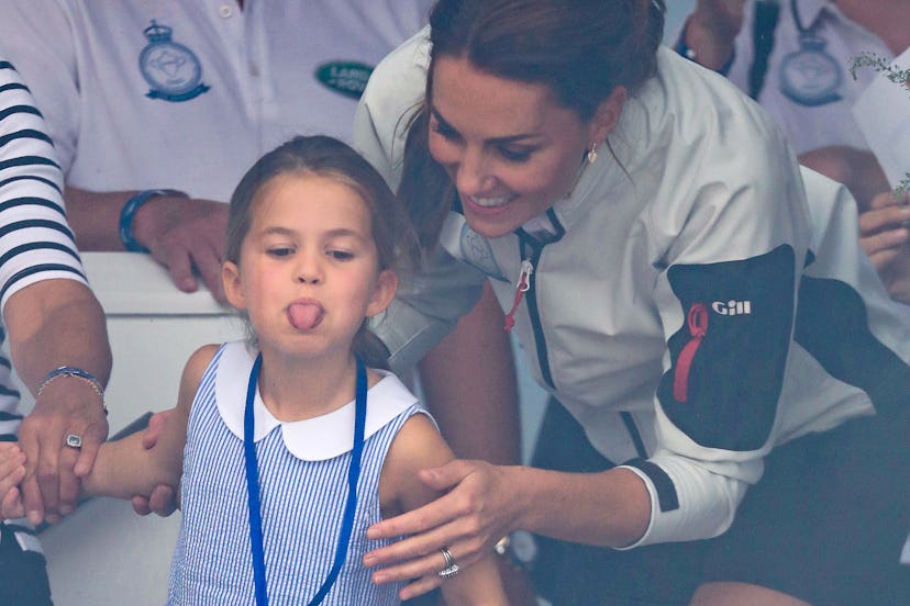 Princess Charlotte sticks her tongue out at a charity sailing event with her parents. 