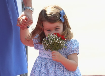 Princess Charlotte smells flowers during a trip in Germany