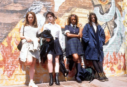 The cast of 'The craft' leaned on a wall with graffiti.