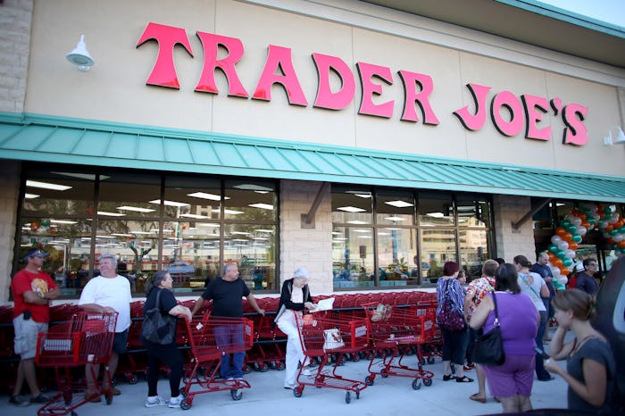 The outside of a Trader Joe's store with people walking around
