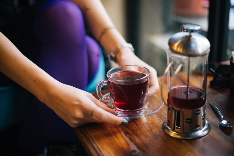 Woman drinking black tea. Tea is one of the healthy drinks that's not water.