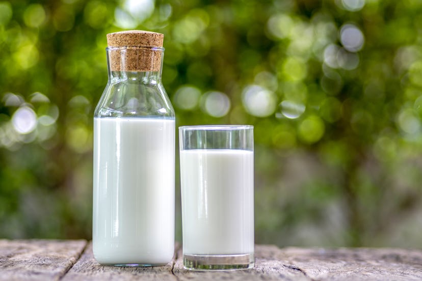 A glass of milk in a carafe and a glass. Milk is one of the healthiest beverages that's not water.