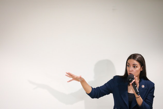 Alexandria Ocasio-Cortez , who is known for her inspiring quotes on female empowerment, speaks into ...