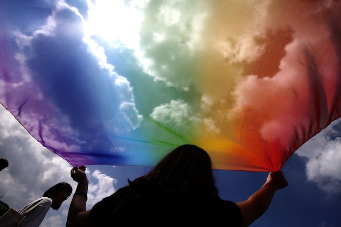 LGBTQ rights flag flies as Supreme Court hears discrimination cases.