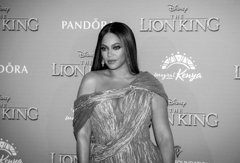 Beyonce Wears poses at The Lion King premiere. Beyonce's feminist quotes can be used as Instagram ca...