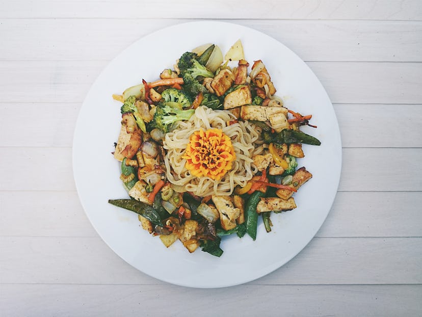A vegetarian noodle salad is presented on a plate. Flexitarian diets may be beneficial for heart hea...