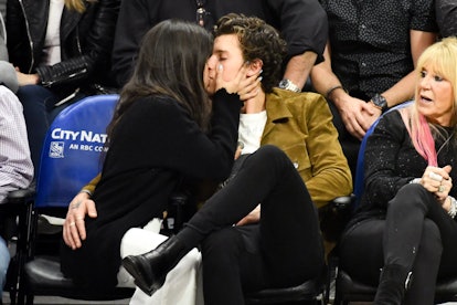 Camila Cabello and Shawn Mendes kiss at a Clippers game on Nov. 11.