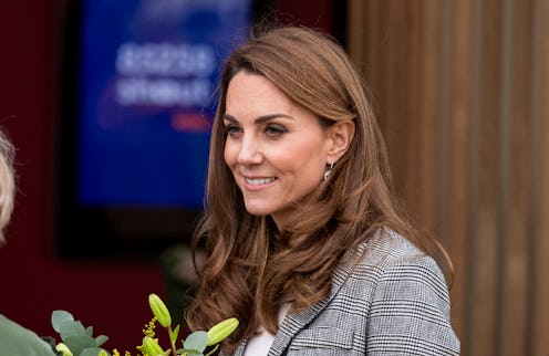 Kate Middleton's burgundy pants and plaid blazer are workwear staples.