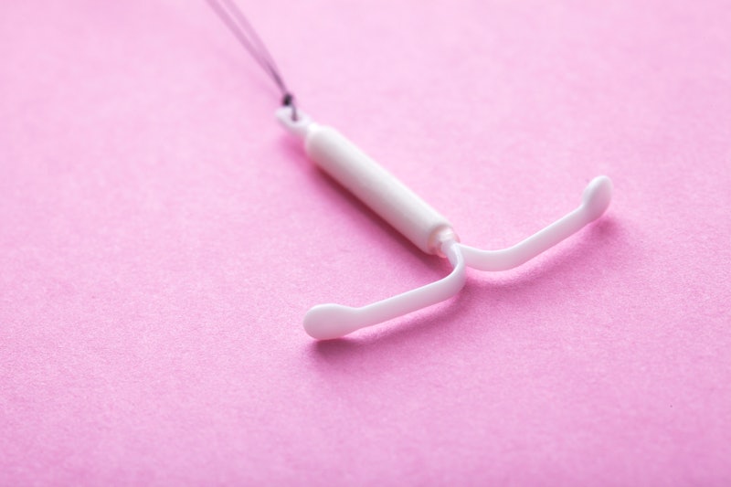 A hormonal IUD. Nine people tell Bustle what having an IUD is like.