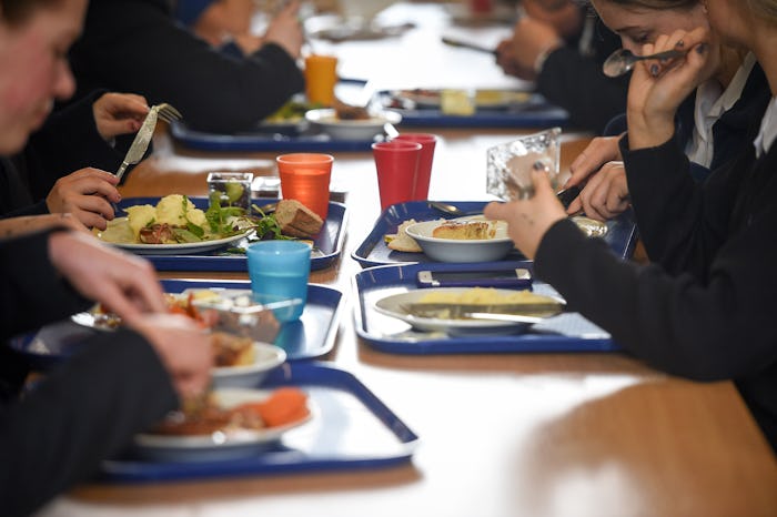 A high school in Minnesota apologized after taking hot lunch from students with outstanding lunch de...
