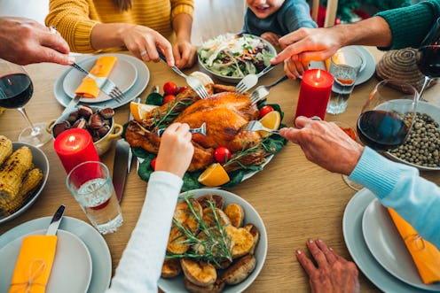 A family tucks into a Thanksgiving turkey. Thanksgiving can be difficult for people who are sober, b...