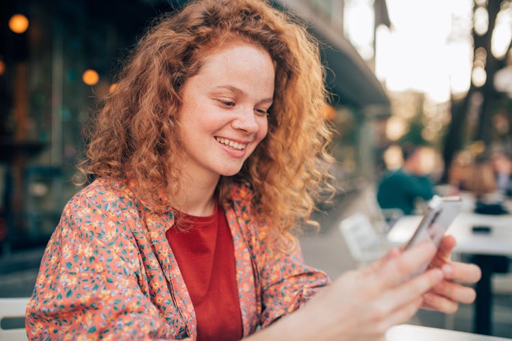 A woman texts her significant other.