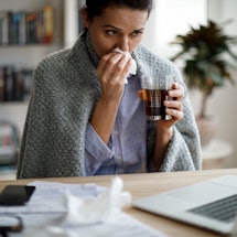 A woman fights the flu. Serious influenza infections can influence the menstrual cycle, but only in ...