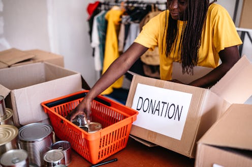 A woman organizes food bank donations during the Thanksgiving and Christmas season.