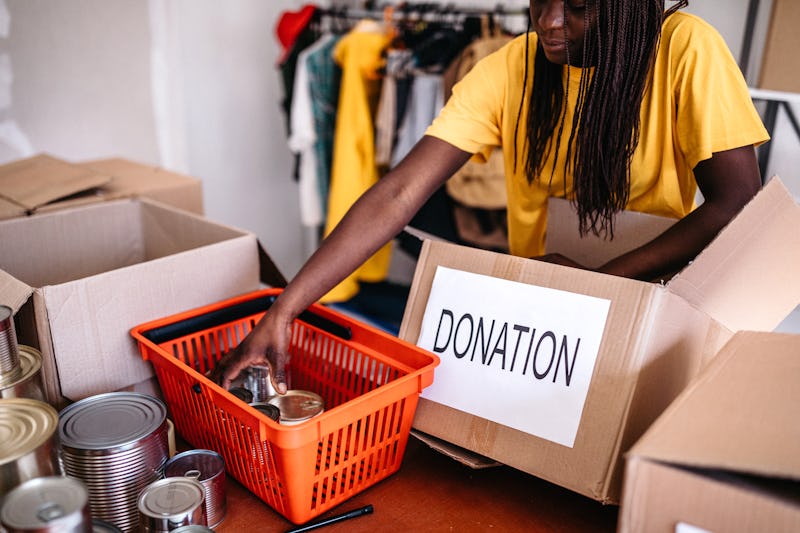 A woman organizes food bank donations during the Thanksgiving and Christmas season.