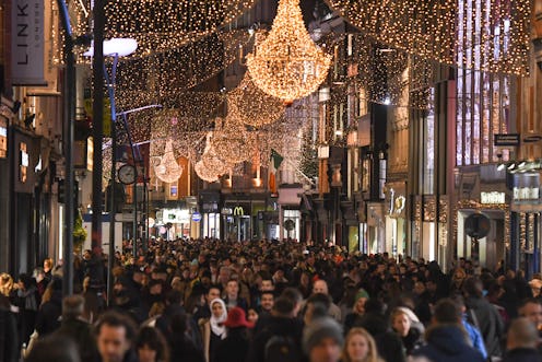 A shopping street crowded during Black Friday. Black Friday deals can produce positive mood, but als...