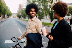 A couple crossing the street