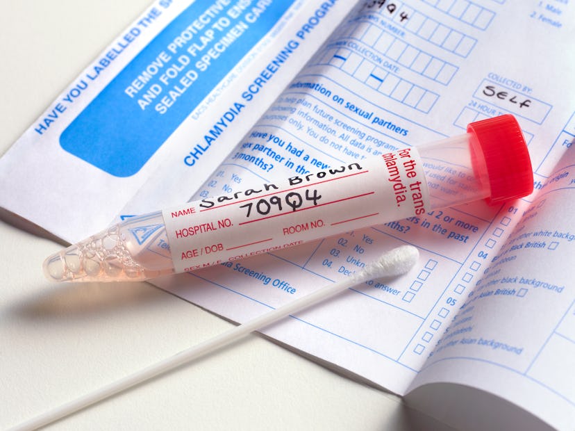 A test tube for HPV with the name Sarah Brown on it and a form for a chlamydia screening program