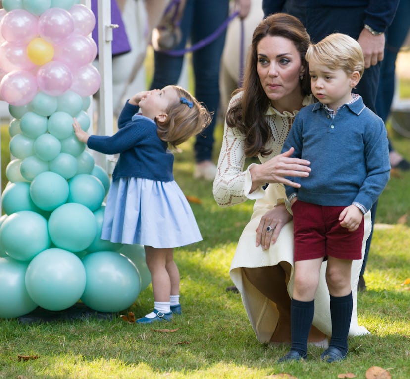 Princess Charlotte cannot get enough of the balloons at a party in British Columbia in September 201...