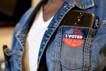 "I voted" badge on the denim jacket