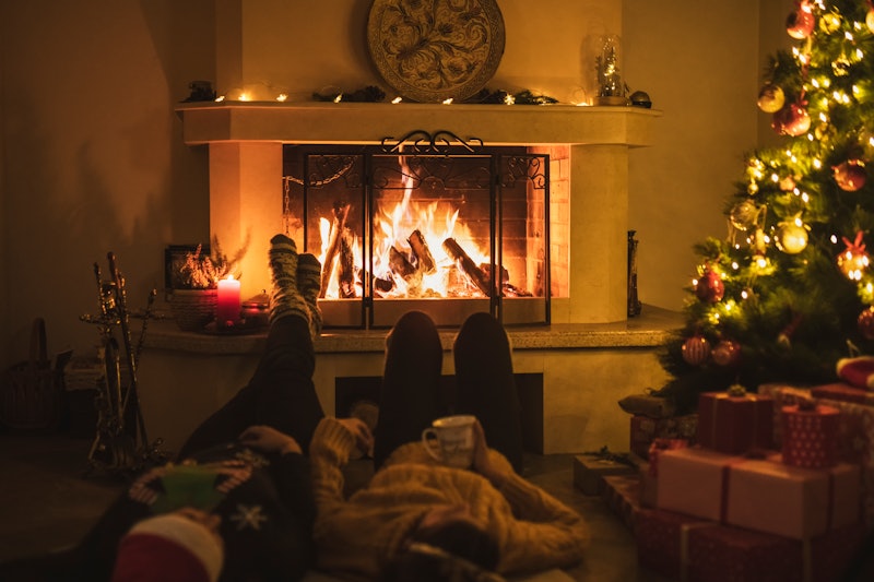 Two siblings talk in front of the fireplace during the holidays. If you're not out or newly out duri...